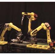 Three robot linkage welding exhaust pipe video